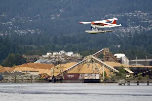 Seaplane flying at Port Vancouver in British Columbia, Canada Seaplane flying at Port Vancouver in British Columbia, Canada