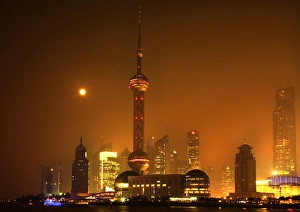 Shanghai Pudong Chna Skyline at Night with TV Tower with Moon and Reflections Orange Shanghai Pudong Chna Skyline at Night with TV Tower with Moon and Reflections Orange