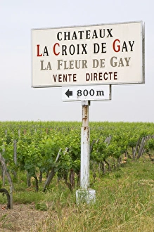 A sign in the vineyards saying Chateaux La Croix de Gay and La Fleur de Gay Vente Directe A sign in the vineyards saying Chateaux La Croix de Gay and La Fleur de Gay Vente Directe