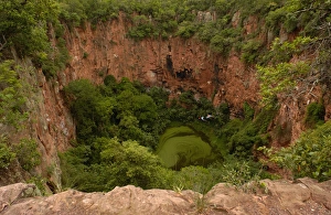 Sink hole now used by Macaws for nesting Serra da Bodoquena. Limestone elevated Sink hole now used by Macaws for nesting Serra da Bodoquena. Limestone elevated