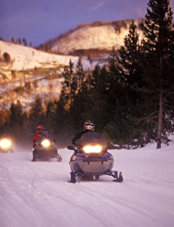 Snowmobilers at the end of the day in Yellowstone National Park Snowmobilers at the end of the day in Yellowstone National Park