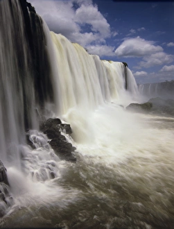 South America, Brazil, Igwazu Falls. Igwacu Falls drops gloriously in to the river below South America, Brazil, Igwazu Falls. Igwacu Falls drops gloriously in to the river below