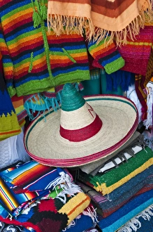 South America, Mexico, Teotihuacan. Sombrero and blankets for sale at market. Credit as South America, Mexico, Teotihuacan. Sombrero and blankets for sale at market. Credit as