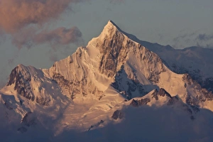 South Atlantic, South Georgia. Sunlit, snow-covered mountain peak at dawn. Credit as South Atlantic, South Georgia. Sunlit, snow-covered mountain peak at dawn. Credit as