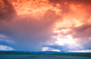 Spring rain clouds at sunset over eastern Oregon farm land. weather, clouds Spring rain clouds at sunset over eastern Oregon farm land. weather, clouds