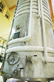 A stainless steel fermentation tank with still wine undergoing cold stabilization A stainless steel fermentation tank with still wine undergoing cold stabilization
