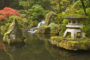 Stone lantern at koi pond at the Portland Japanese Garden, Oregon Stone lantern at koi pond at the Portland Japanese Garden, Oregon