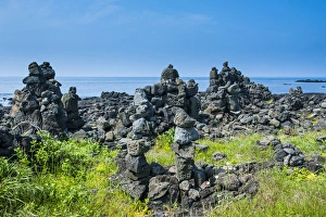 Stone walls made by tourists on the Unesco world heritage sight the island of Jejudo Stone walls made by tourists on the Unesco world heritage sight the island of Jejudo