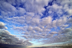 The storm clouds break up to reveal the blue early morning sky above The storm clouds break up to reveal the blue early morning sky above