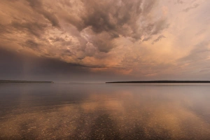 Stormy skies at sunrise over Lake Superior from Manitou Island in the Apostle Islands Stormy skies at sunrise over Lake Superior from Manitou Island in the Apostle Islands
