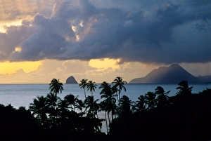 The sun sets behind Diamond Rock viewed from the island of Martinique in the Caribbean The sun sets behind Diamond Rock viewed from the island of Martinique in the Caribbean