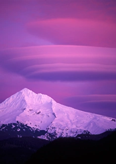 Sunset colored magenta Lenticular clouds over Mt Hood, Oregon Sunset colored magenta Lenticular clouds over Mt Hood, Oregon