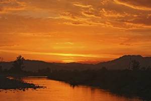Sunset over Ramganga river, Corbett National Park, India Sunset over Ramganga river, Corbett National Park, India