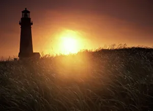 Sunset over Yaquina Head Lighthouse, Oregon coast Sunset over Yaquina Head Lighthouse, Oregon coast