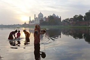 Taj Mahal & collecting water on the banks of the River Yamuna, Agra, India Taj Mahal & collecting water on the banks of the River Yamuna, Agra, India