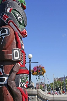 Totem hanging floral baskets along waterfront Victoria British Columbia Totem hanging floral baskets along waterfront Victoria British Columbia