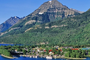 Tour boat cruising Waterton Lake in Waterton Lakes National Park in Alberta Canada Tour boat cruising Waterton Lake in Waterton Lakes National Park in Alberta Canada