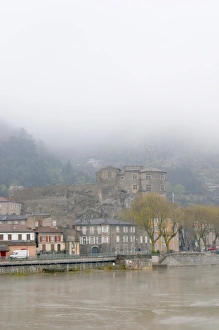 The town Tournon across the Rhone river with the Chateau de Tournon. under snow The town Tournon across the Rhone river with the Chateau de Tournon. under snow