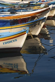 Turkey, Kusadasi along the Aegean Sea with the brighly colored fishing boats Turkey, Kusadasi along the Aegean Sea with the brighly colored fishing boats