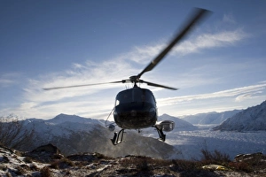 USA, Alaksa, Helicopter landing on summit of Lions Head peak above Matanuska Glacier USA, Alaksa, Helicopter landing on summit of Lions Head peak above Matanuska Glacier