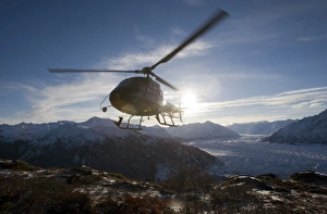 USA, Alaska, Helicopter landing on summit of Lions Head peak above Matanuska Glacier USA, Alaska, Helicopter landing on summit of Lions Head peak above Matanuska Glacier