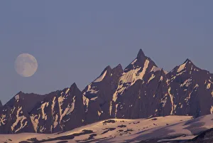 USA, Alaska, Valdez Moon rises above rugged Chugach Range mountains near Valdez USA, Alaska, Valdez Moon rises above rugged Chugach Range mountains near Valdez