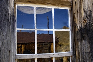 USA, California, Bodie State Historic Park, Ghost town building reflected in window USA, California, Bodie State Historic Park, Ghost town building reflected in window