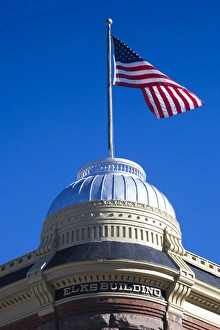 USA, Colorado, Aspen, Elks Building and US flag USA, Colorado, Aspen, Elks Building and US flag
