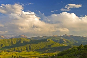 USA, Colorado, Aspen, Old Snowmass Valley. Summer sunset on green mountain vista USA, Colorado, Aspen, Old Snowmass Valley. Summer sunset on green mountain vista
