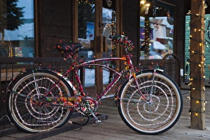 USA, Colorado, Crested Butte, Elk Avenue, bicycle covered in colored lights USA, Colorado, Crested Butte, Elk Avenue, bicycle covered in colored lights