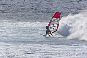 USA, Hawaii, Maui, Hookipa Beach Park. Man windsurfing in front of wave. Credit as USA, Hawaii, Maui, Hookipa Beach Park. Man windsurfing in front of wave. Credit as
