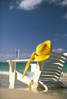 USA, Hawaii. Sun hat and lounge chair on beach USA, Hawaii. Sun hat and lounge chair on beach