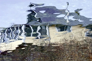 USA, Maine, Harpswell. Cottage reflected in water USA, Maine, Harpswell. Cottage reflected in water