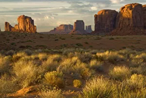 USA, Utah, Monument Valley National Park. Sunrise illumines rock formations USA, Utah, Monument Valley National Park. Sunrise illumines rock formations
