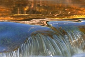 USA, Vermont. Autumn reflections on cascade in stream USA, Vermont. Autumn reflections on cascade in stream