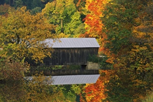 USA, Vermont. Covered bridge and autumn reflections USA, Vermont. Covered bridge and autumn reflections