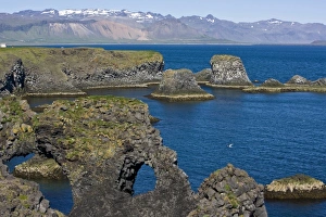 View of basaltic rock formations on the Snaefellsness peninsula near Snaefellsjokull volcano View of basaltic rock formations on the Snaefellsness peninsula near Snaefellsjokull volcano