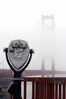 A view of the Golden Gate Bridge hidden in the fog A view of the Golden Gate Bridge hidden in the fog