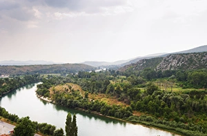 View from the hilltop tower over the Neretva river and the plain in the river valley View from the hilltop tower over the Neretva river and the plain in the river valley