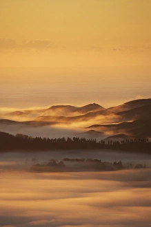 View from Te Mata Peak and Early Light on Morning Mist, Hawkes Bay, North Island View from Te Mata Peak and Early Light on Morning Mist, Hawkes Bay, North Island