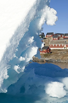 Village and iceberg Ittoqqortoormiit Scorsby Sund Greenland Village and iceberg Ittoqqortoormiit Scorsby Sund Greenland