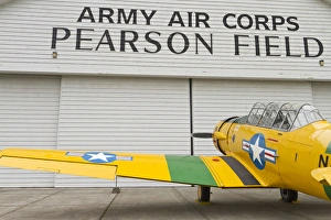 A vintage World War II military trainer aircraft parked at a hangar at Pearson Field A vintage World War II military trainer aircraft parked at a hangar at Pearson Field