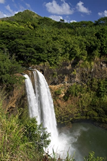 Wailua Falls located on the Wailua River in Wailua River State Park on the eastern Wailua Falls located on the Wailua River in Wailua River State Park on the eastern