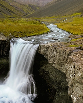 Water running from Glacier and waterfall, Iceland Water running from Glacier and waterfall, Iceland
