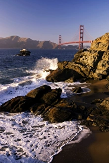 Waves crash on the California coast overlooking the Golden Gate Bridge Waves crash on the California coast overlooking the Golden Gate Bridge