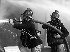 Two firefighters at King George V Dock, East London Two firefighters at King George V Dock, East London