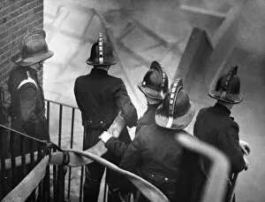 Adjoining Collection: London firefighters at work on staircase, Carron Wharf