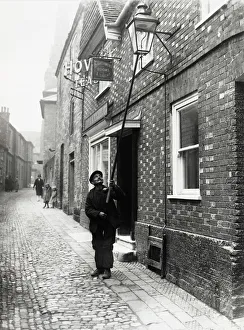 Lamplighter in Lombard St., Petworth, 1931 Lamplighter in Lombard St., Petworth, 1931