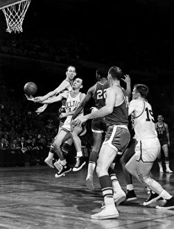 Images Dated 2nd December 2011: BASKETBALL GAME, c1960. Bob Cousy of the Boston Celtics (number 14)