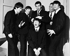 THE BEATLES, 1964. American speed skater Terry McDermott (center), gold medal winner at the 1964 Winter Olympics, attempts to give a haircut to Paul McCartney of the Beatles prior to their appearance on the Ed Sullivan Show in New York City, 9 February 1964, while fellow Beatles, and host Sullivan (behind McDermott), look on THE BEATLES, 1964. American speed skater Terry McDermott (center), gold medal winner at the 1964 Winter Olympics, attempts to give a haircut to Paul McCartney of the Beatles prior to their appearance on the Ed Sullivan Show in New York City, 9 February 1964, while fellow Beatles, and host Sullivan (behind McDermott), look on